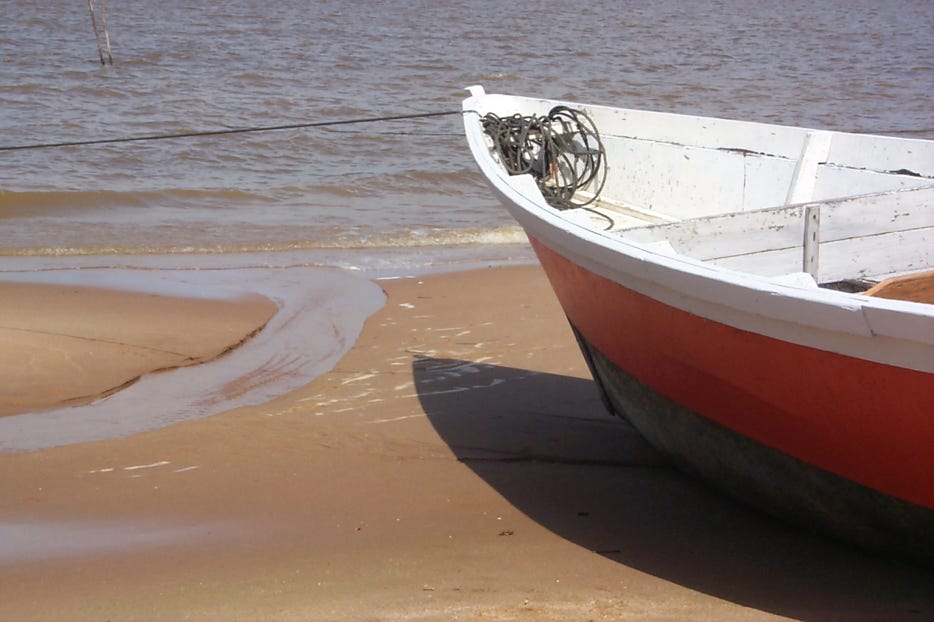 Boat on the beach of Galibi in Surinam
